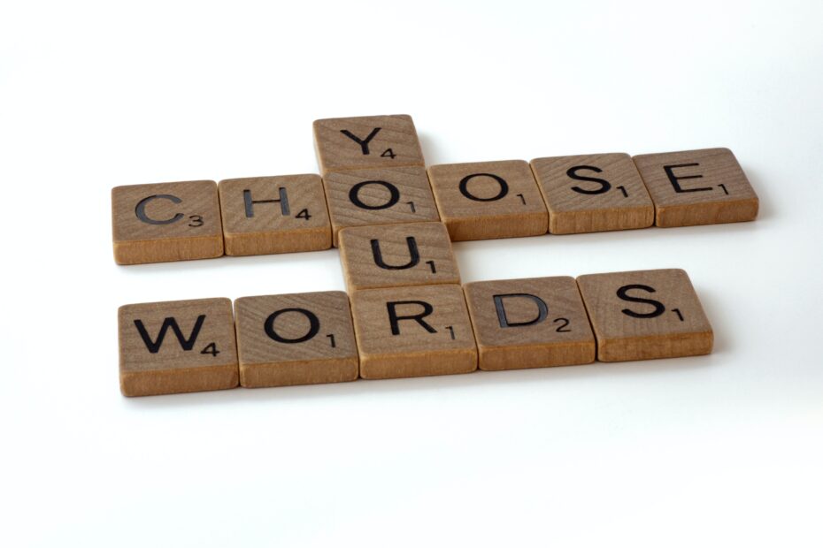 scrabble tiles spelling "choose your words"